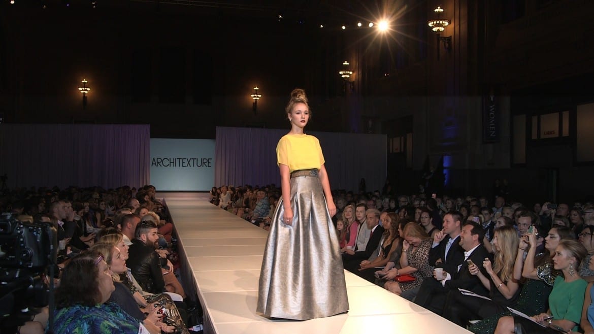 A runway model walks at KC Fashion Week.