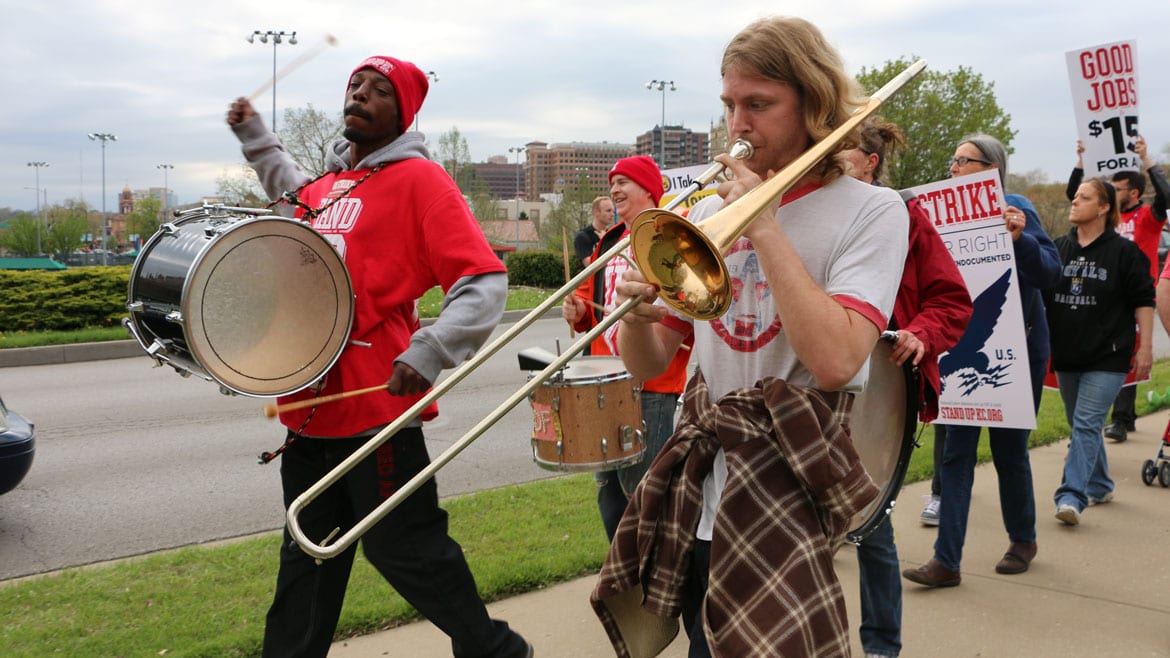 protesters marching with instruments