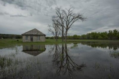 Water flooding from the North Platte River surrounds a shed near Lewellen, Neb. (Photo: Peter Stegen | Platte Basin Timelapse)