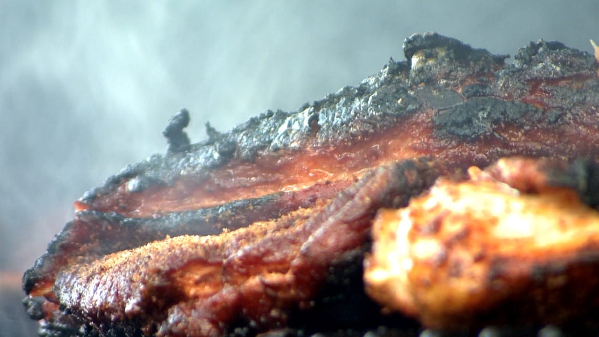 Ribs and chicken sizzle over charcoal at the “Ribstock” barbecue contest in Millard, Neb. (Photos: Brian Seifferlein | Harvest Public Media)