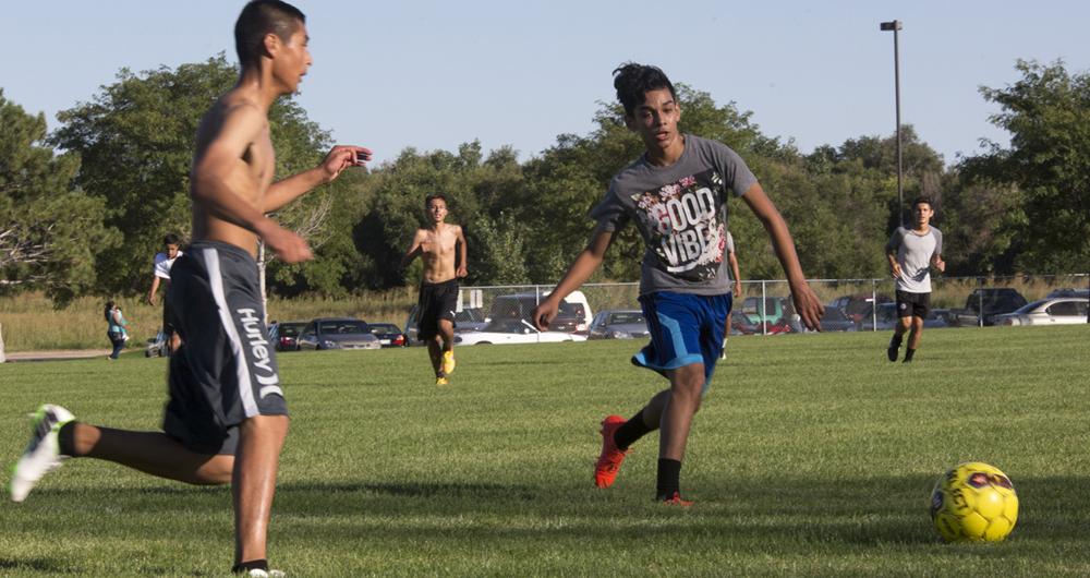 James Lara chases the ball at a scrimmage at Mustangs practice.