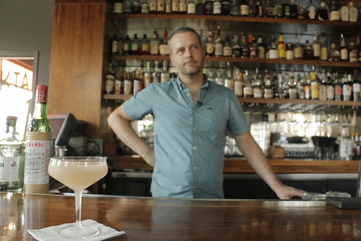 Julep's Beau Williams with the bar's Hemingway Daiquiri. (Photo: Cole Blaise | Flatland)