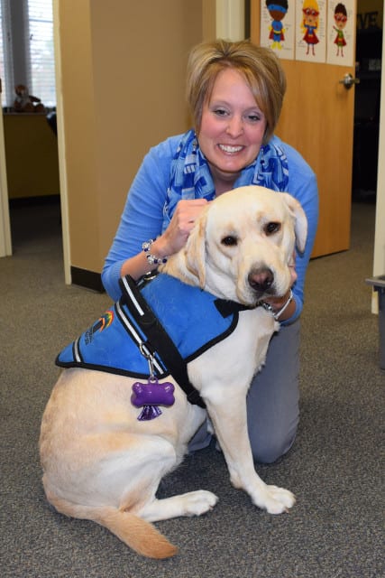 Principal with therapy dog