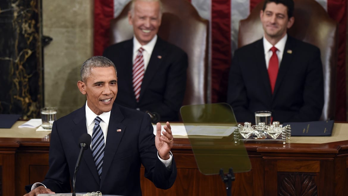 Vice President Joe Biden and House Speaker Paul Ryan of Wis., listen as President Barack Obama gives his State of the Union address to a joint session of Congress on Capitol Hill in Washington on Tuesday. (Photo: Susan Walsh | AP)