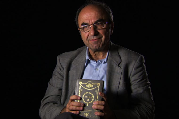 Rexhep Hoxha from 'Besa: The Promise.' holding Hebrew prayerbook