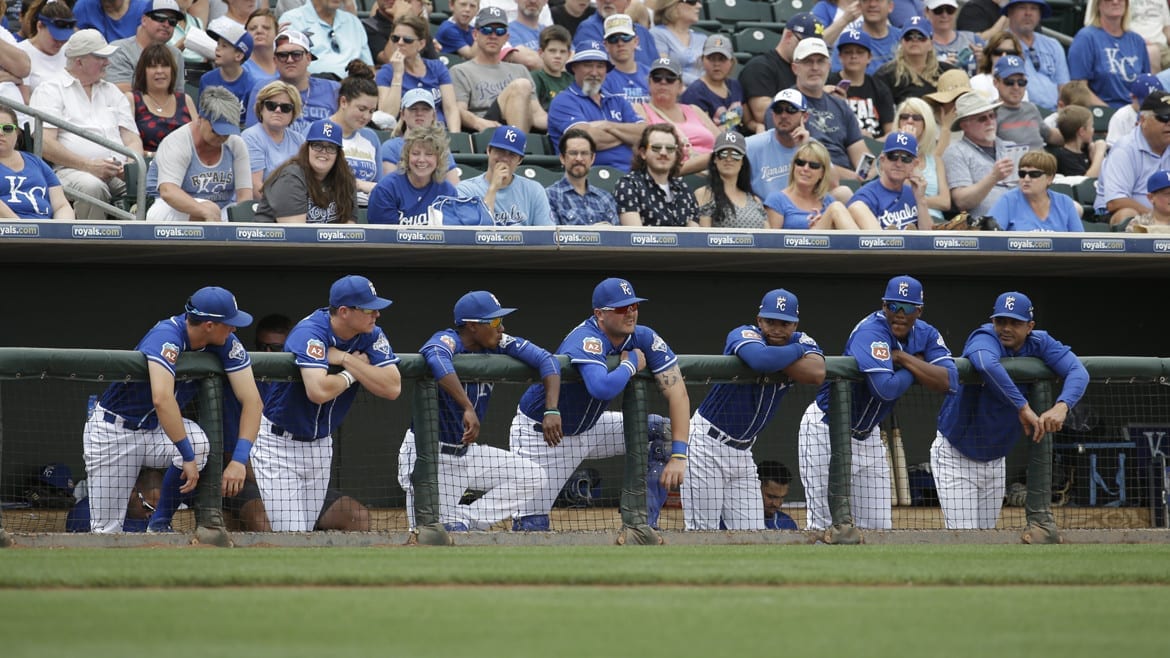 Baseball players waiting in the dugout.