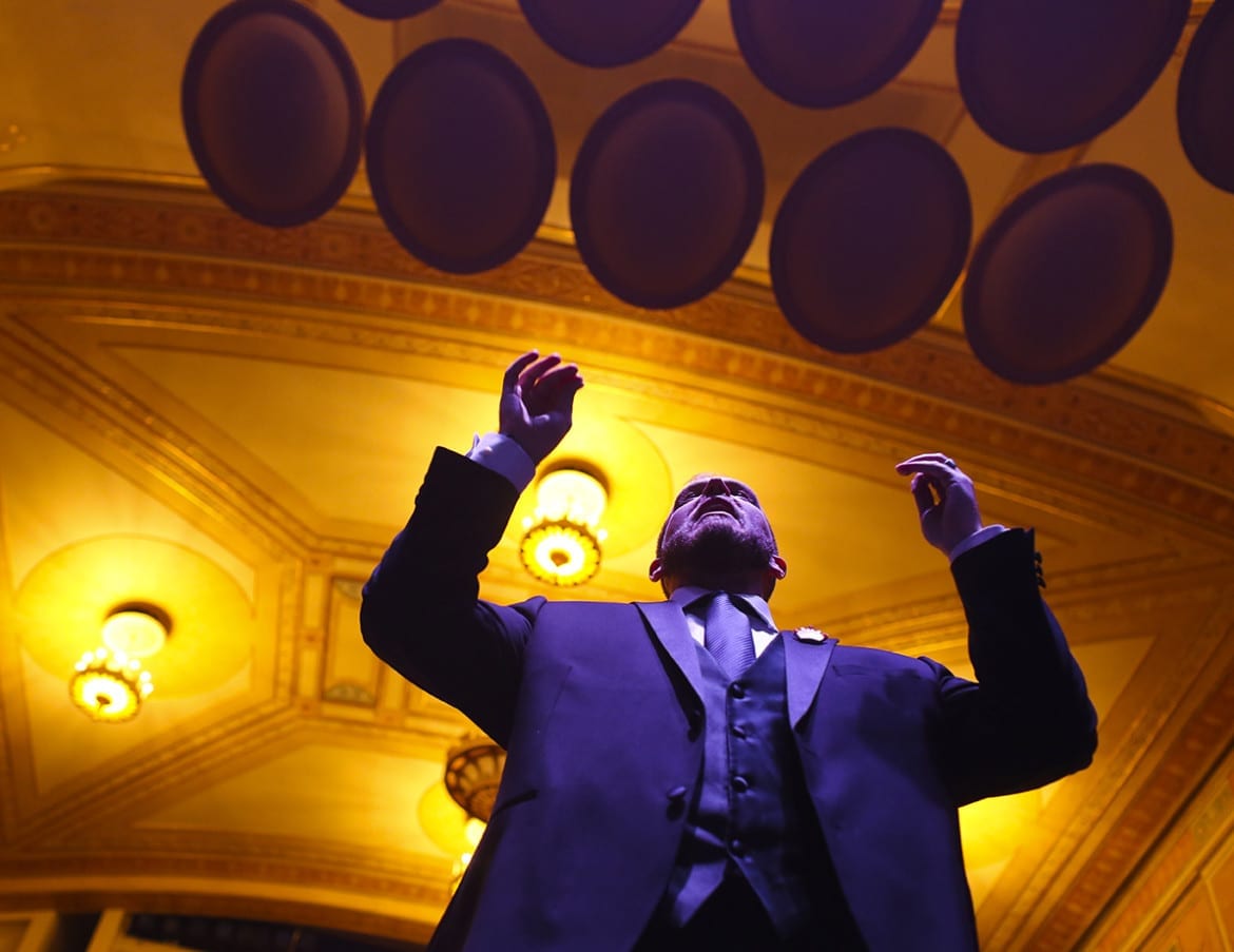 Artistic Director, Dustin Cates leads the Heartland Men's Chorus during a rehearsal on Thursday, December 3rd at The Folly Theater for their Holiday Concert. (Photo: Jim Barcus)