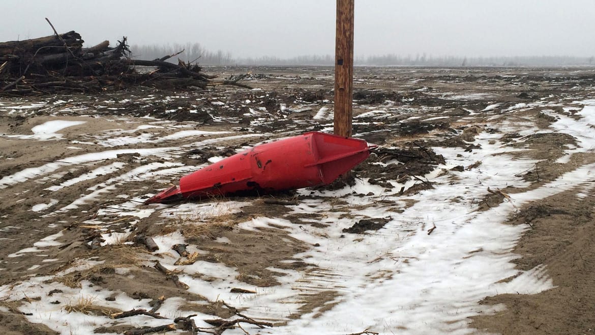 Winter flooding in Alexander county, Illinois, left farmland covered in water, sand and debris.