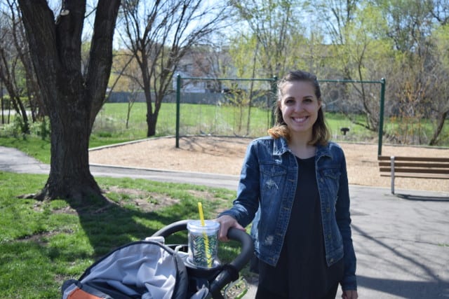 A woman pushing a baby stroller