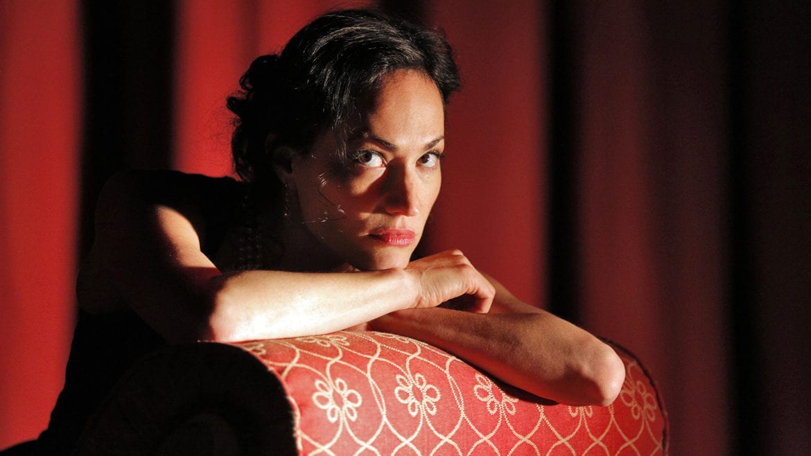 A brooding woman on a couch