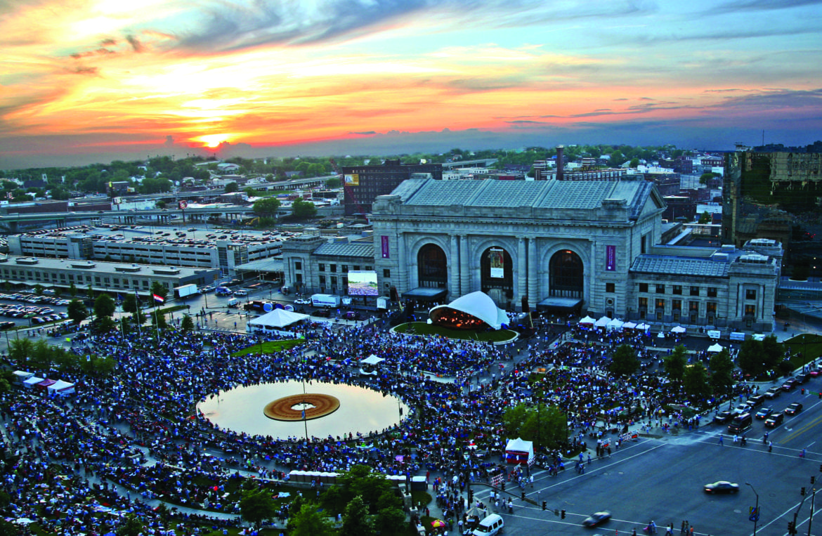 A crowd of people outside of Union Station listening to the symphony