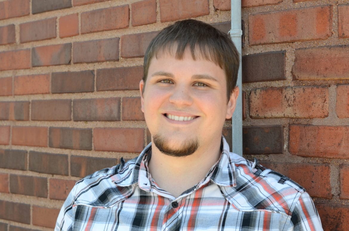 A man i front of a wall