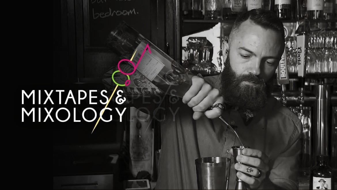 A bartender pouring a drink