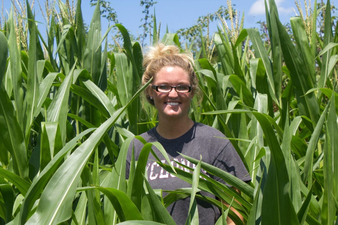 A woman standing in a field.