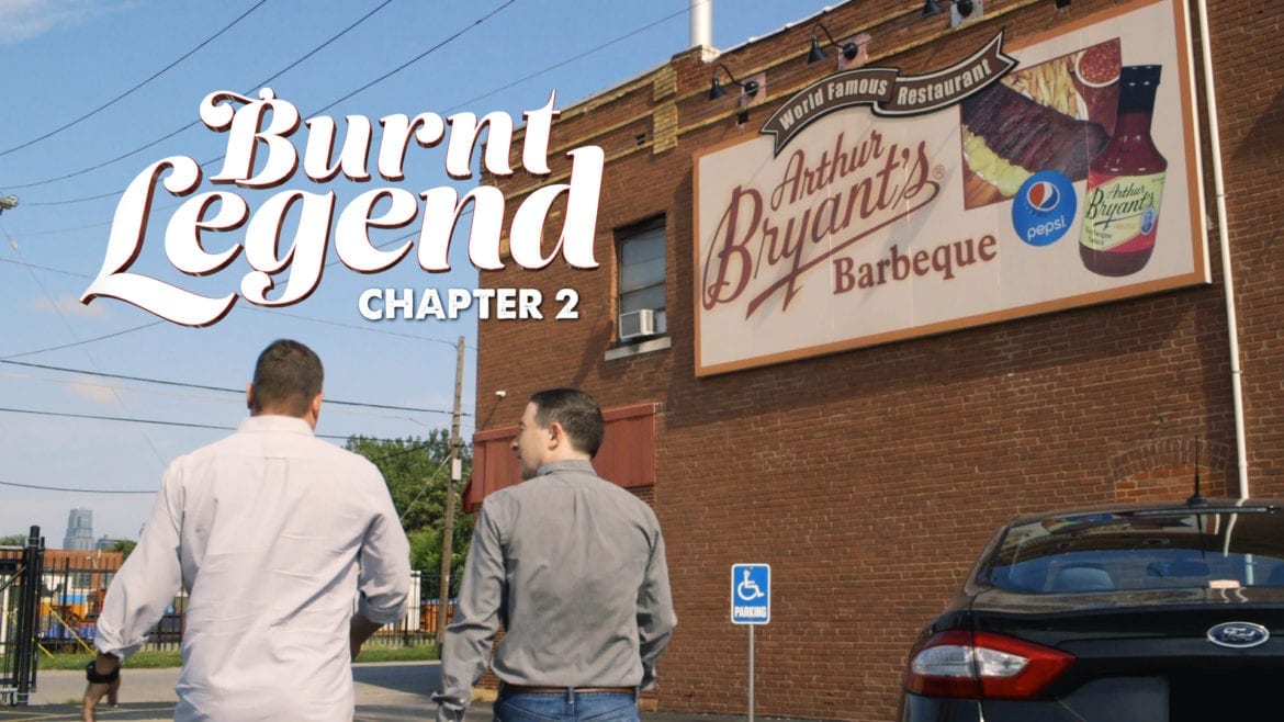 Two men walking int a BBQ joint