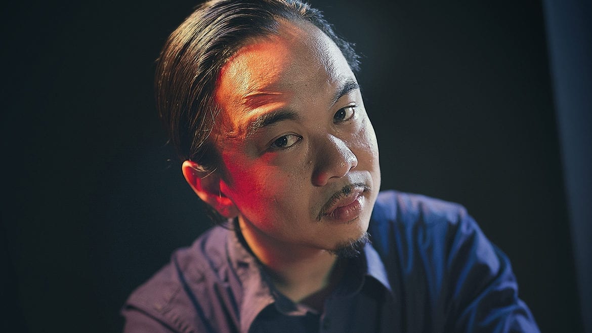 Portrait of local artist, Vi Tran. Photo by Jim Barcus