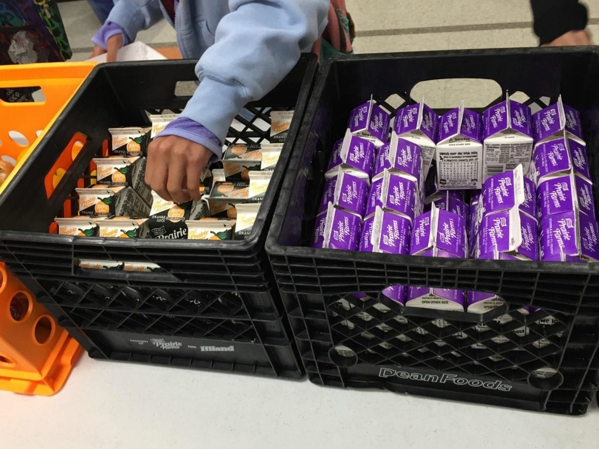 Milk cartons in a bin.