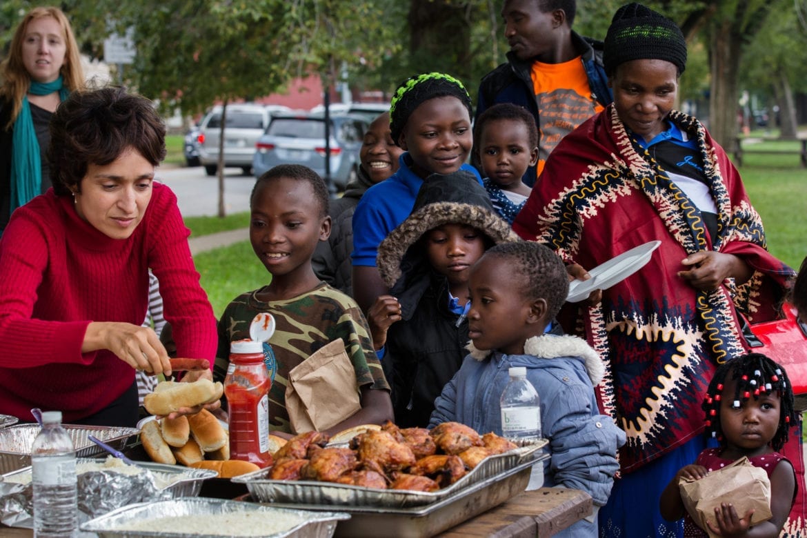 A volunteer helps a Tanzanian family