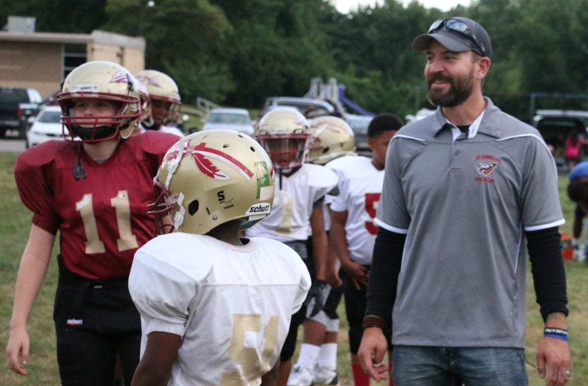 Nick Sanford with his youth football players