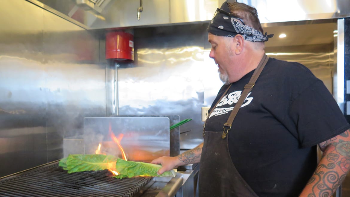 Ernie Locke chars romaine lettuce on the grill 