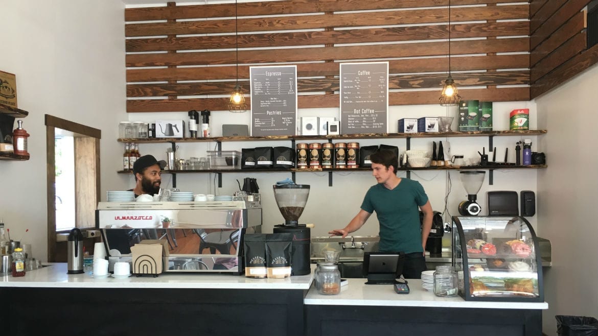 two baristas in a coffee shop