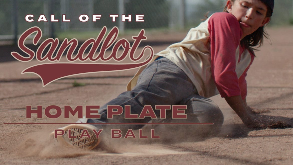 A baseball player slides into home plate for "Call of the Sandlot."