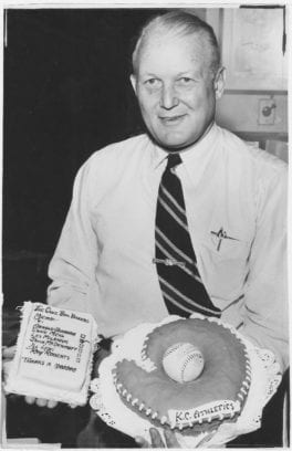 two cakes, one in the shape of a baseball mitt