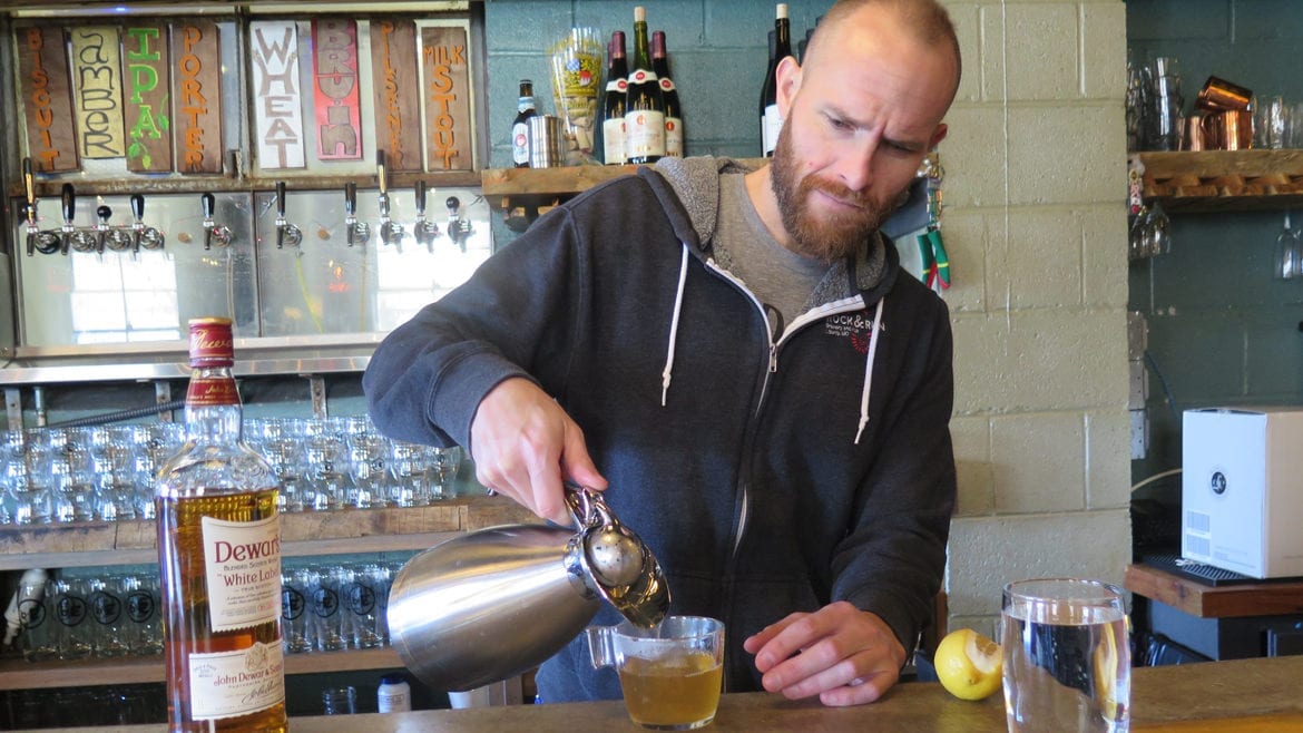 Bartender Sam Shepard serves a hot worty