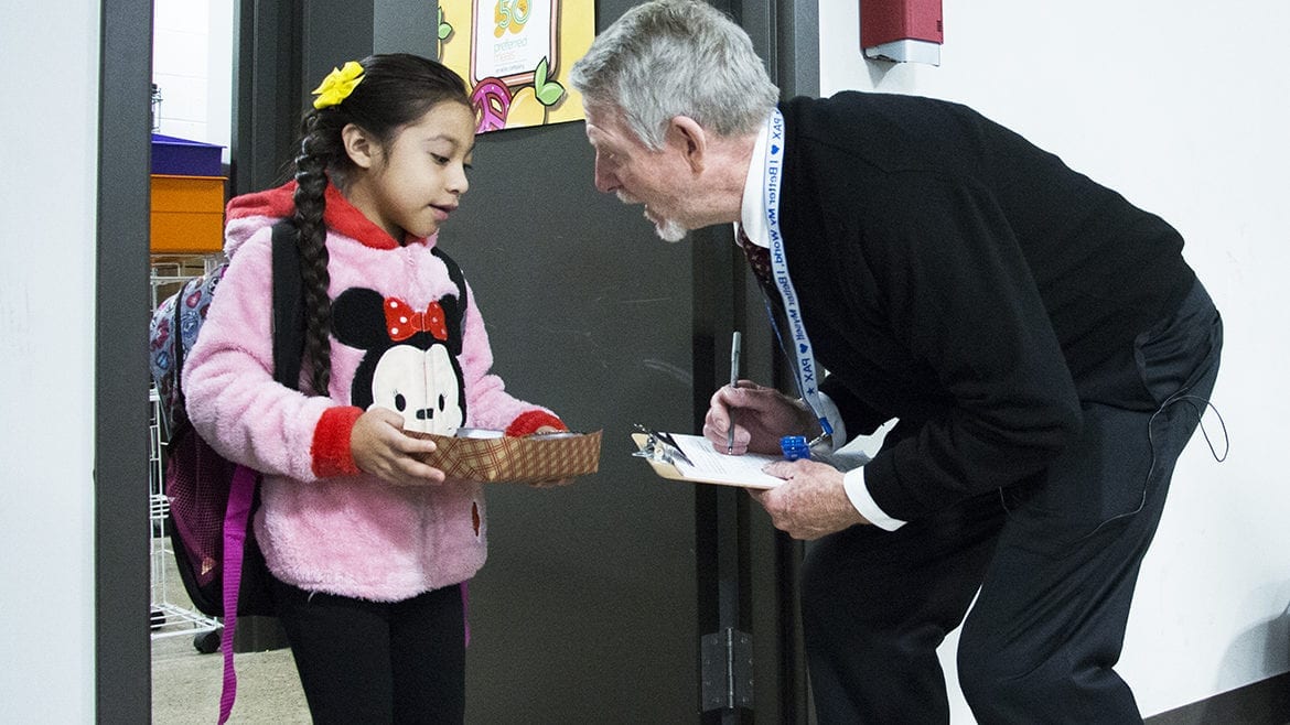 paul preston greeting a student