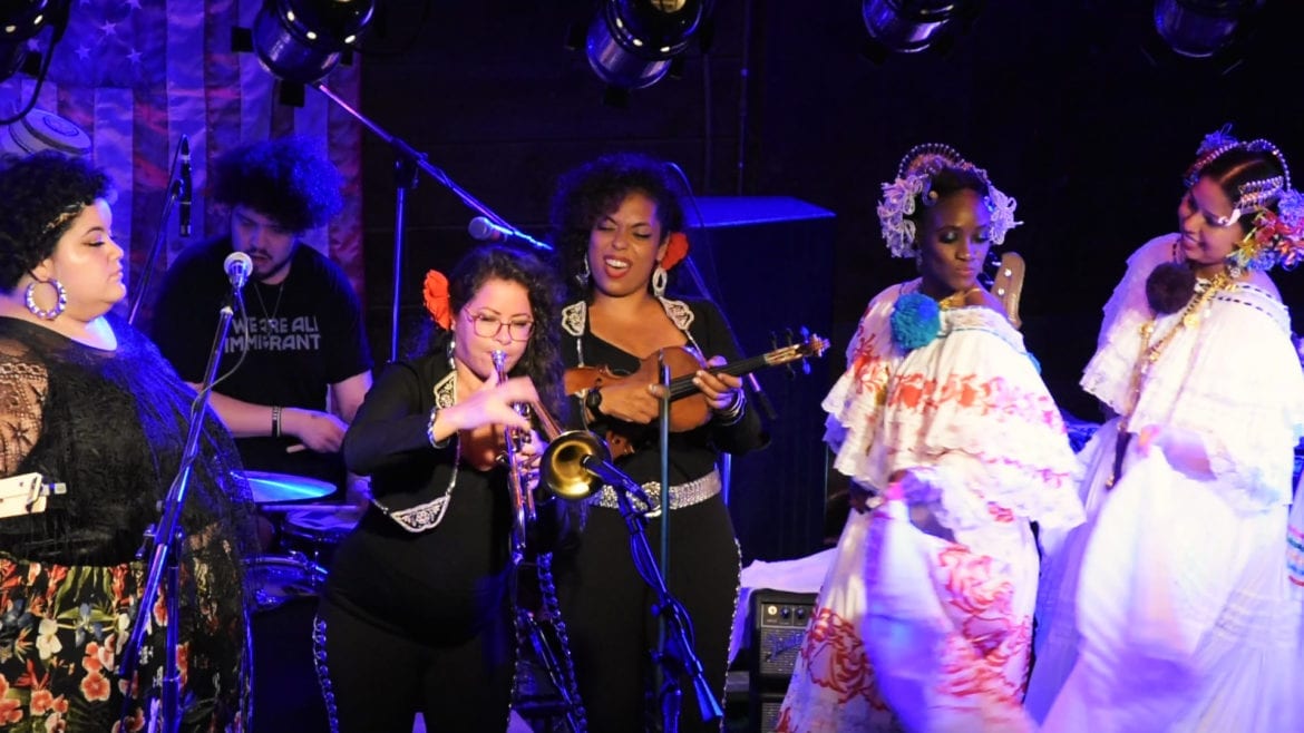 women singing and playing instruments