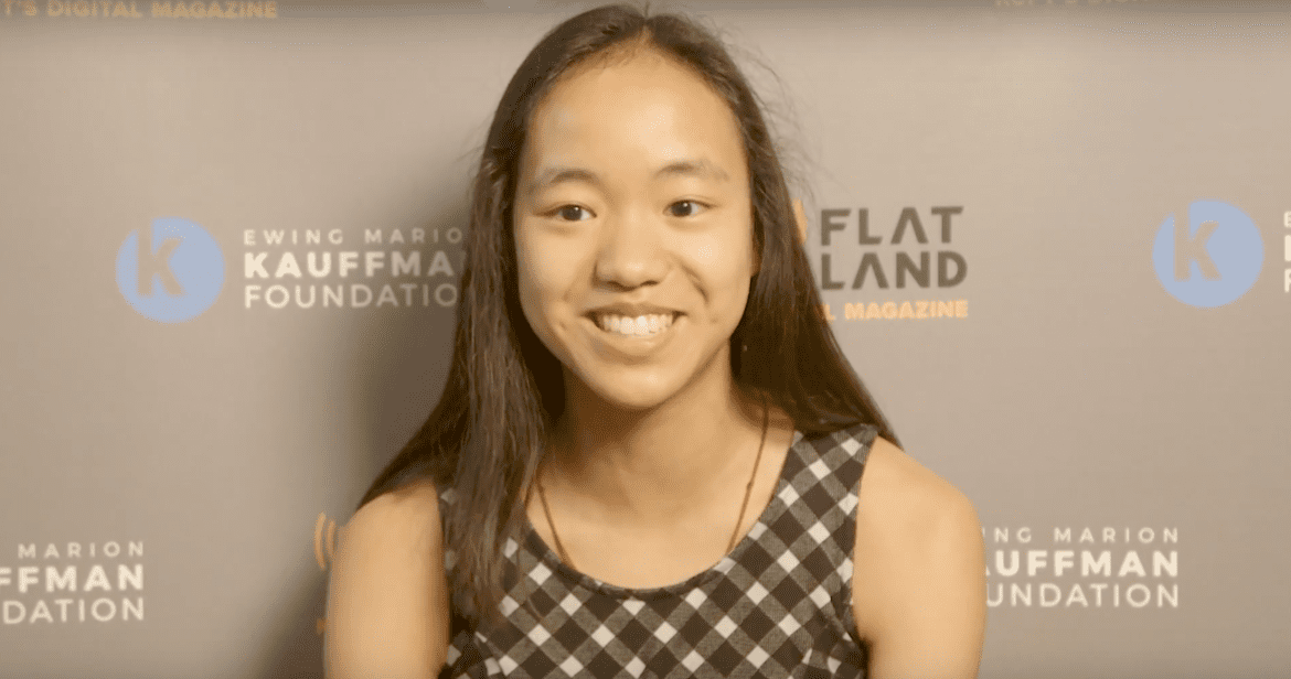 A young girl speaking on screen