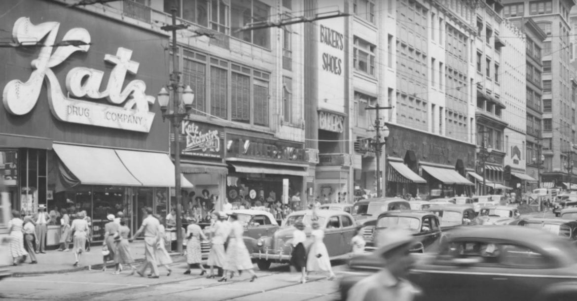 an old photo os a bustling street/