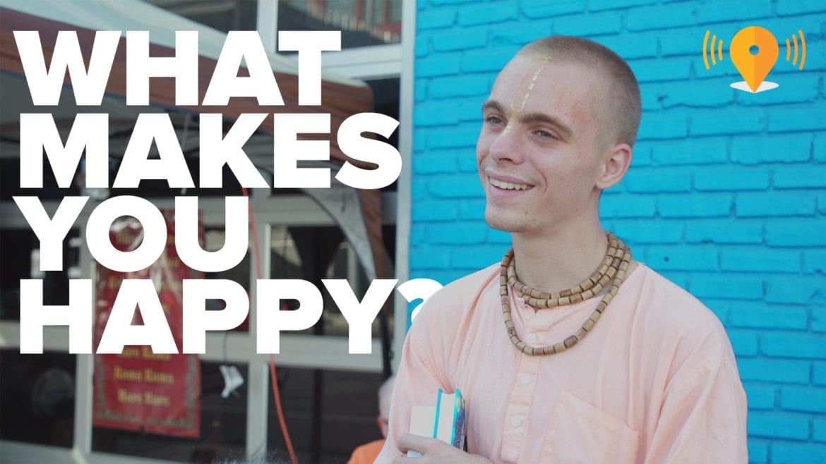 a man against a blue wall