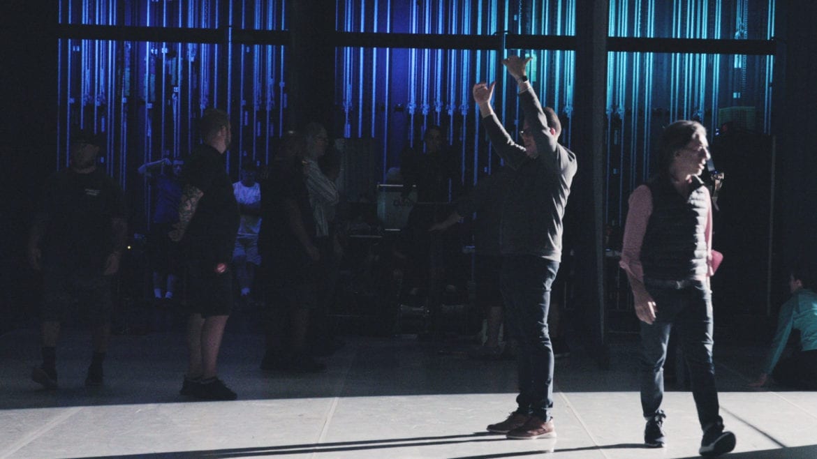 a man behind a stage