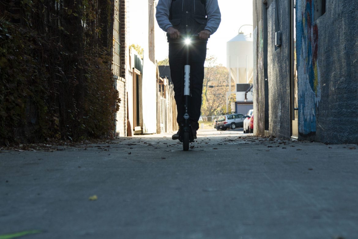 man riding a Bird scooter
