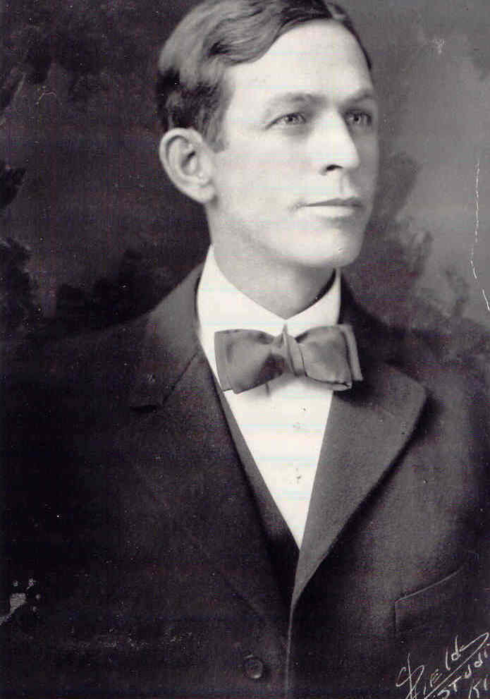 A black and white photo of a man.