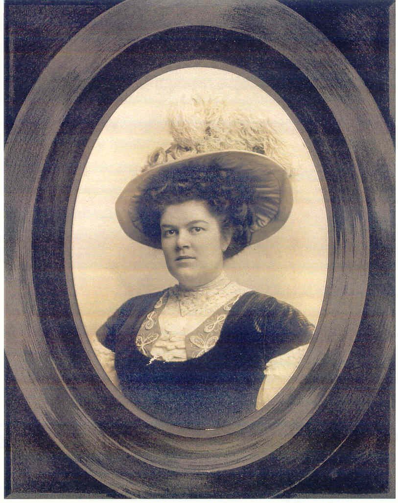 A black and white framed photo of a woman.