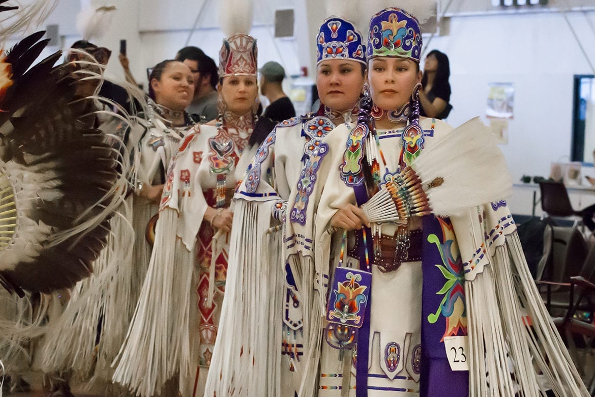 The junior and senior buckskin dancers line up
