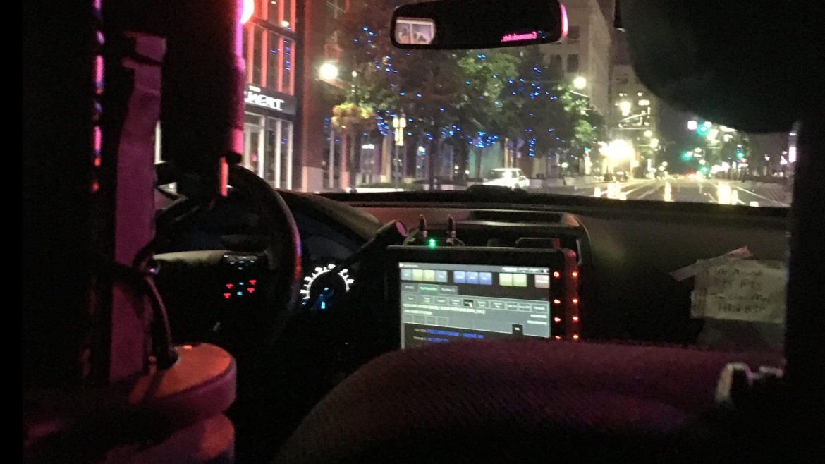 inside of police car on patrol
