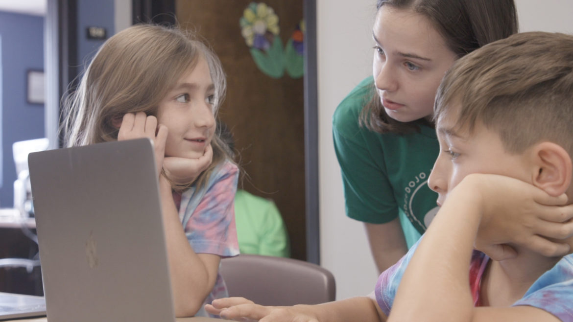 Picture of three children and a laptop computer.