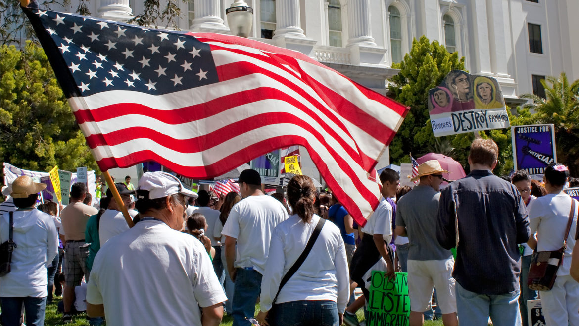 American flag held by man