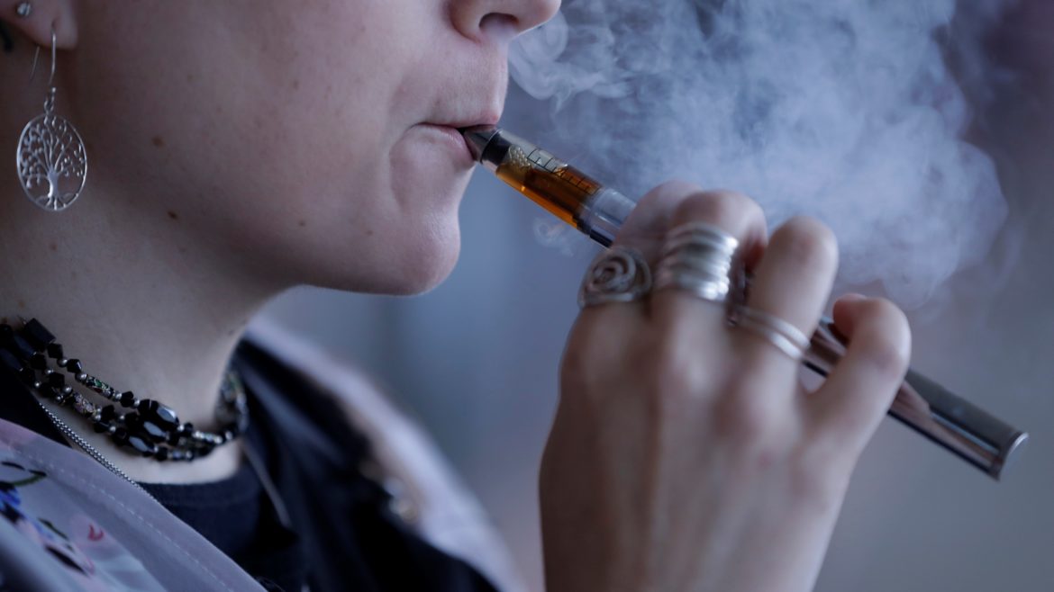 A woman using an electronic cigarette.