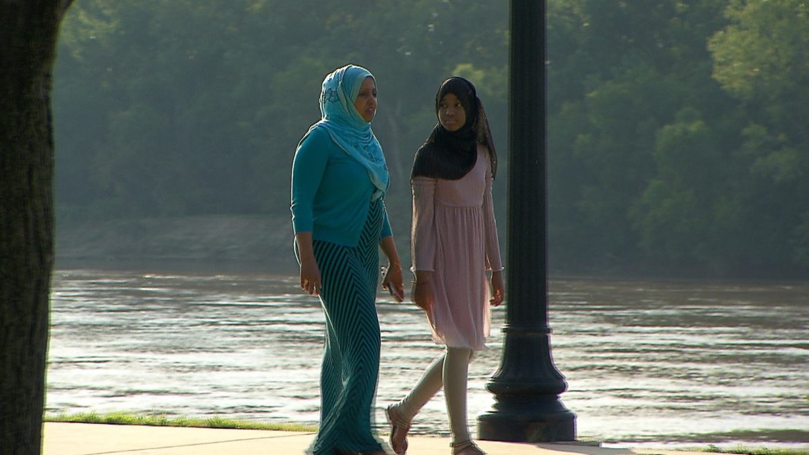 The journey of Muni Abdi (left) began in war-torn Somalia and ended in Kansas City.