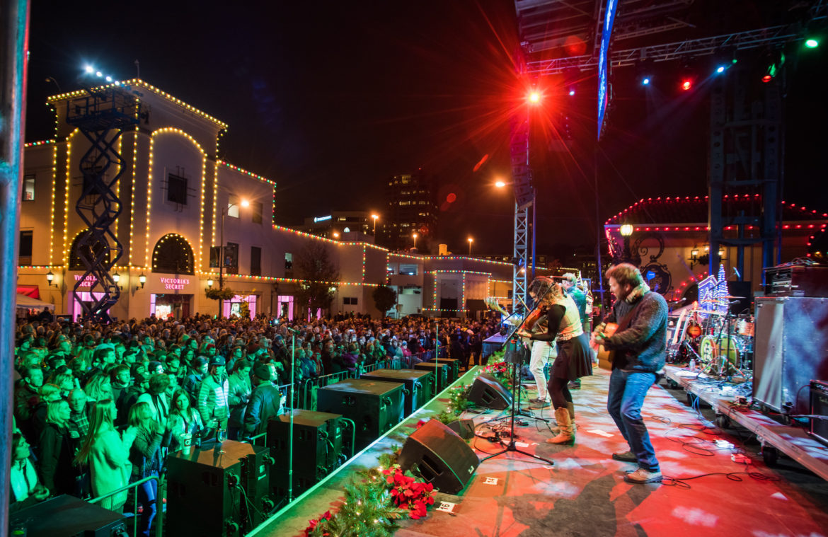 A band plays on stage at the Plaza Lighting Ceremony/
