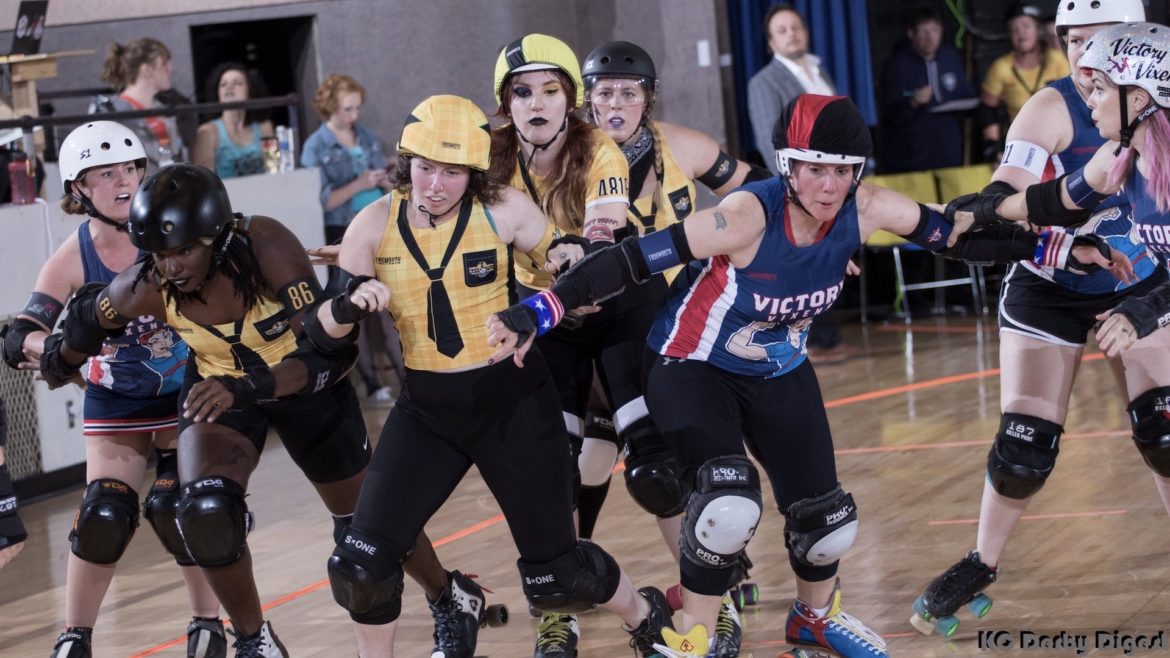 A pack of skater shove their way toward the camera.