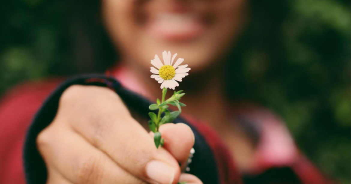 Kid holding flower