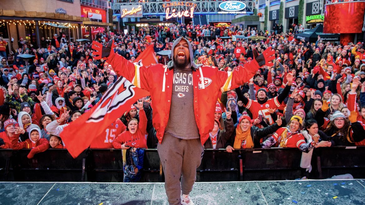 Kansas City rapper Tech N9ne poses on stage at the KC Live! Chiefs watch party