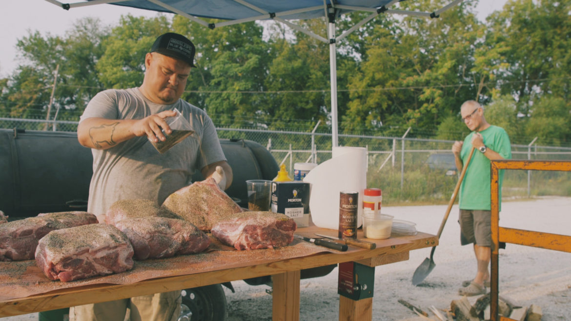 Tyler and Bob Harp prepping "craft barbecue" brisket.