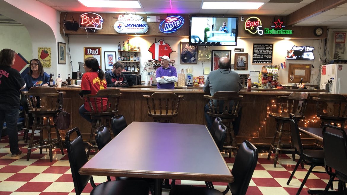 St. John's Catholic Club members hang out around the bar.