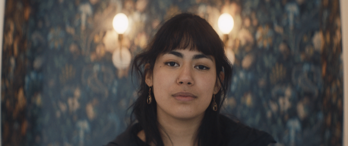 A barista at the Monarch cafe in Kansas City looks into the camera